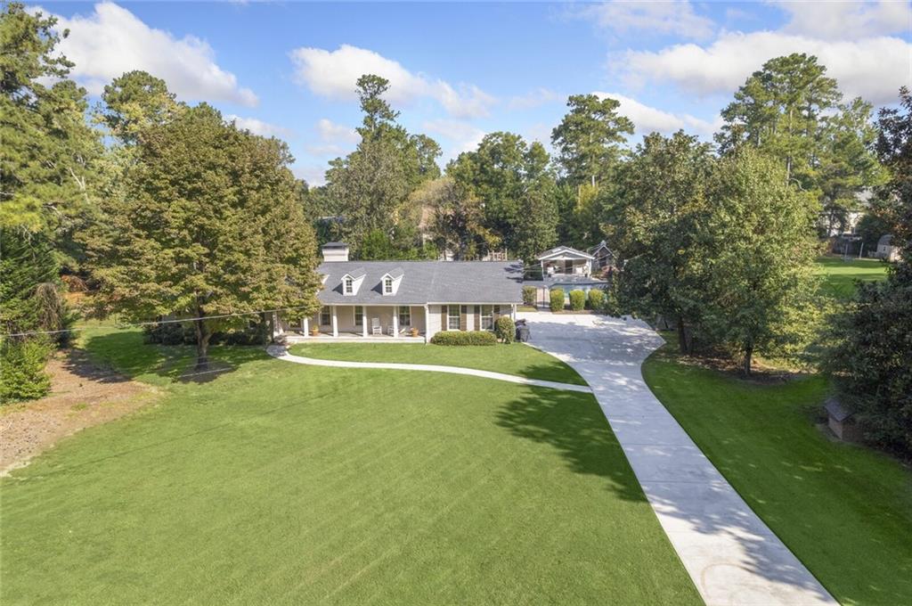 265 North Mill Road Atlanta, GA 30328 - Photo 1 of 1 a view of a house with a yard
