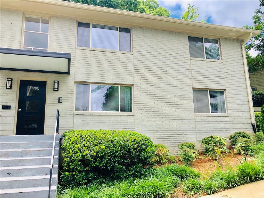 449 Clairemont Avenue, Unit E2 Decatur, GA 30030 - Photo 1 of 1 a view of a house with potted plants