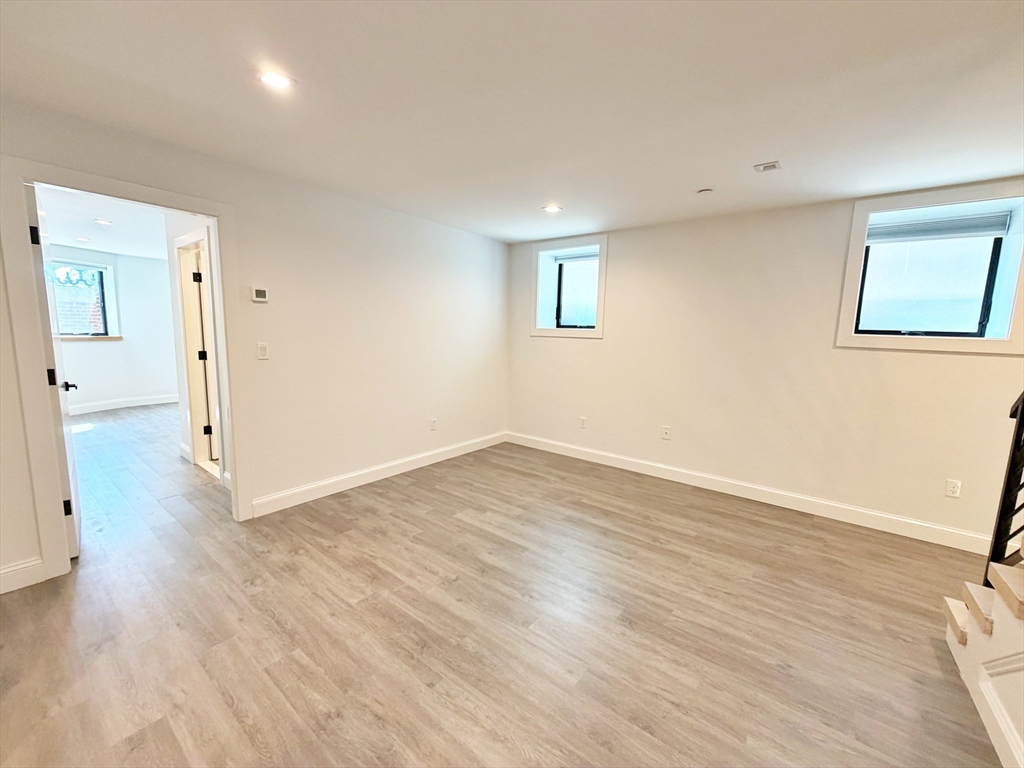 182 Webster Street, Unit 1 Boston, MA 02128 - Photo 31 of 41 wooden floor in an empty room