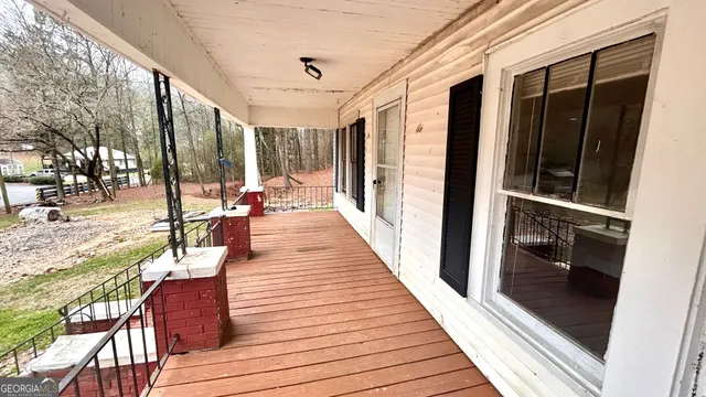 a view of a balcony with chairs