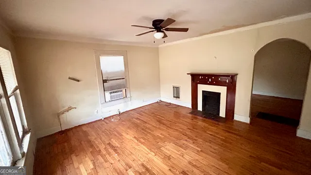 a bedroom with a bed and a fireplace