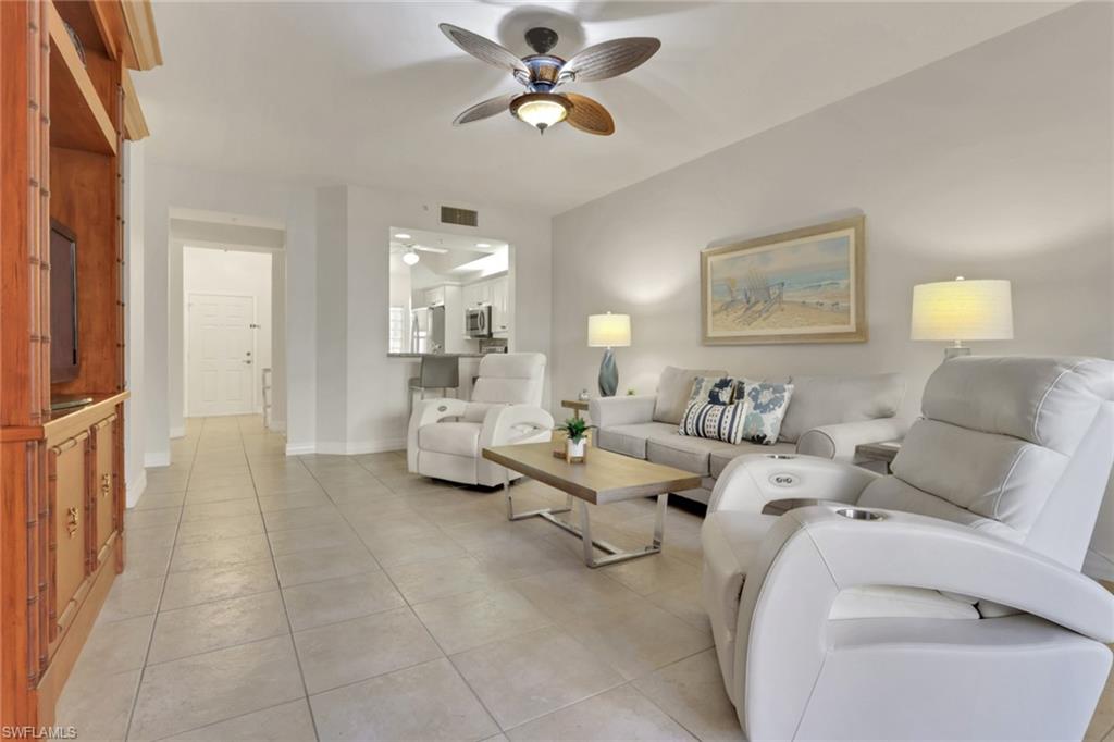 401 Bayfront Place, Unit 3207 Naples, FL 34102 - Photo 2 of 22 Living room with light tile patterned floors and a ceiling fan