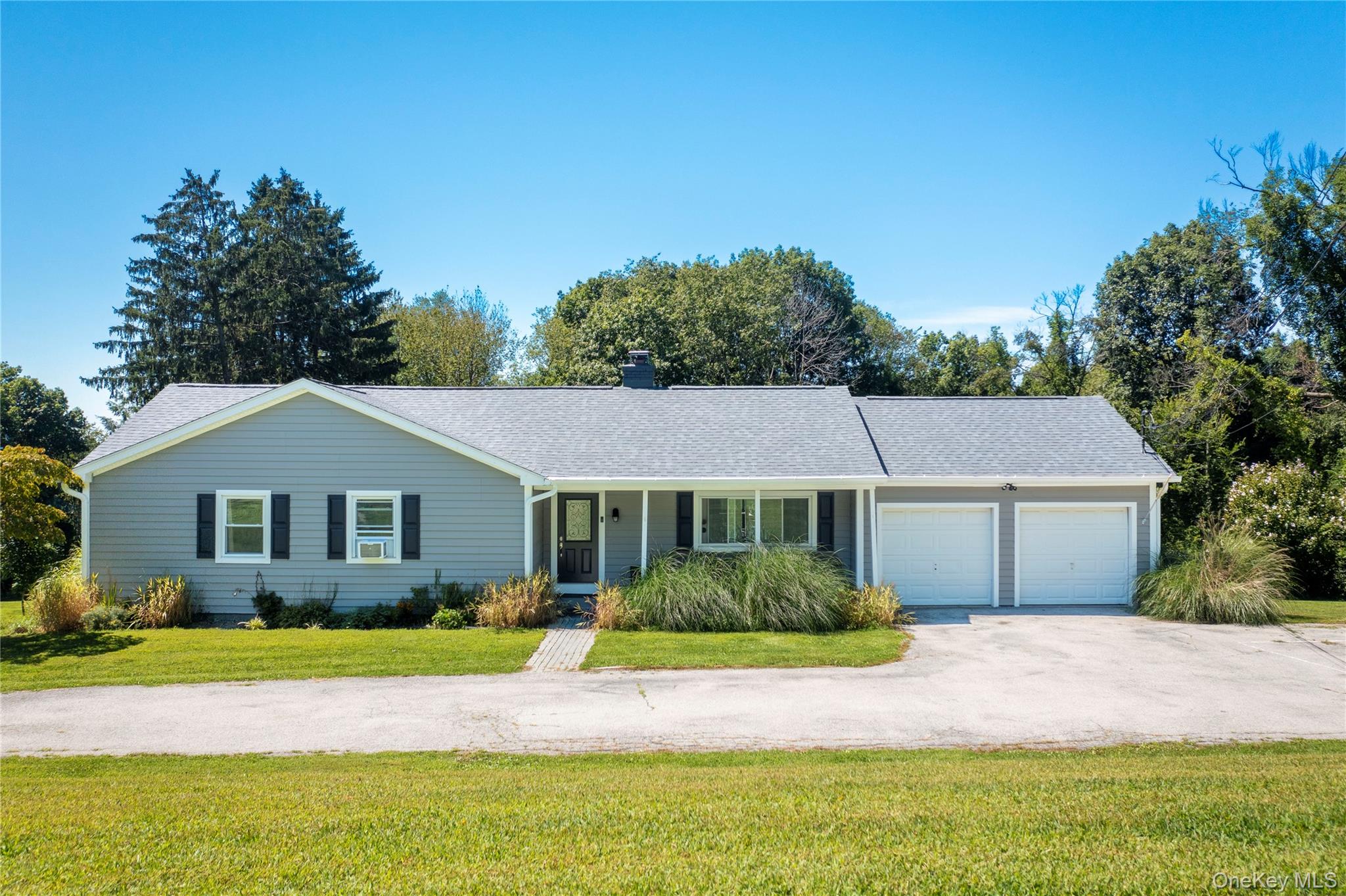 73 Hillside Road Poughquag, NY 12570 - Photo 1 of 1 Single story home featuring asphalt driveway, covered porch, a front lawn, and an attached garage