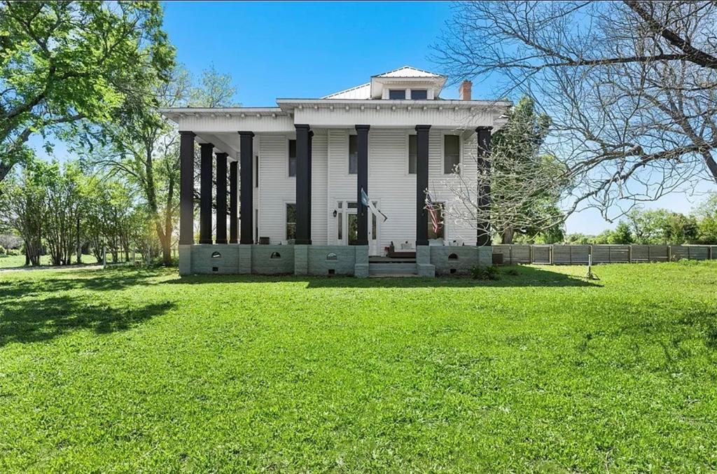 1004 South Old Temple Road Lorena, TX 76655 - Photo 2 of 40 Rear view of house featuring fence, a lawn, and a porch