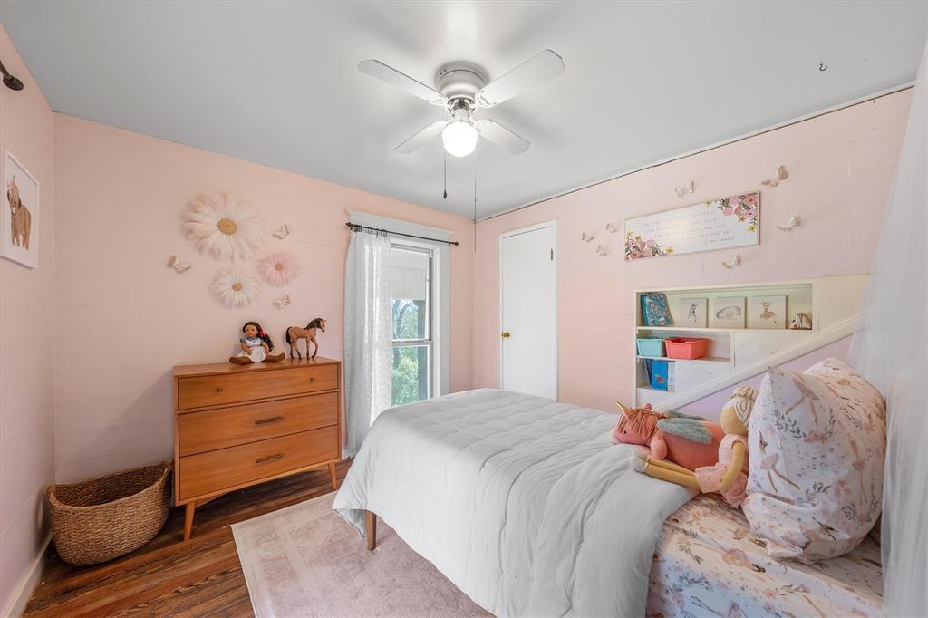 1004 South Old Temple Road Lorena, TX 76655 - Photo 25 of 40 Bedroom with wood finished floors and a ceiling fan