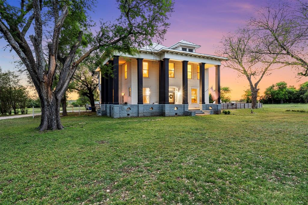 1004 South Old Temple Road Lorena, TX 76655 - Photo 3 of 40 Rear view of house featuring a lawn and a porch