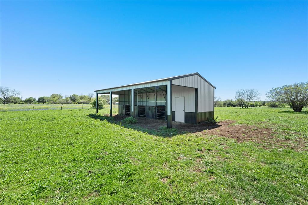 1004 South Old Temple Road Lorena, TX 76655 - Photo 37 of 40 View of pole building with a rural view and a yard