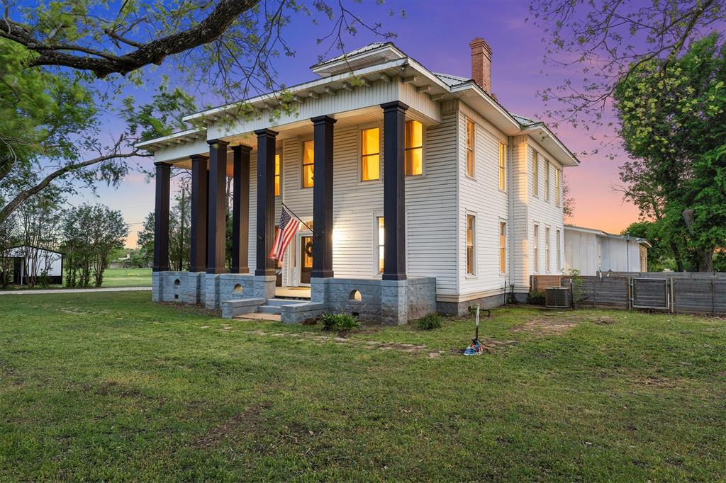 1004 South Old Temple Road Lorena, TX 76655 - Photo 4 of 40 View of front facade with fence, a front lawn, a chimney, and central AC