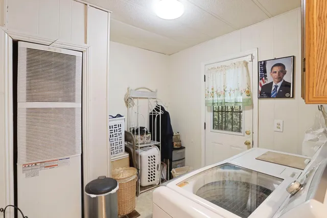 a kitchen with cabinets appliances a sink and a counter top space