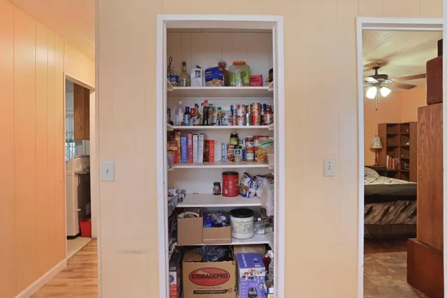 a bed room with a bed and a chair