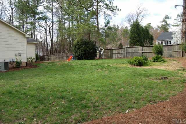7408 Player Court Raleigh, NC 27615 - Photo 11 of 12 Room for a playhouse or storage room in this great backyard Other