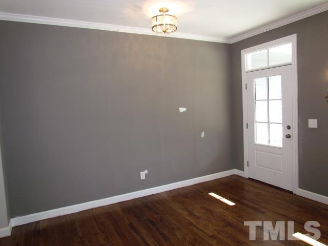 1644 Forest Road Wake Forest, NC 27587 - Photo 3 of 23 Site finished hardwoods, crown moulding, gorgeous overhead lighting, custom wall color