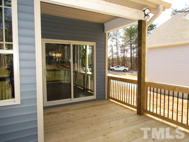 1644 Forest Road Wake Forest, NC 27587 - Photo 22 of 23 Covered deck off of the back of the home leads to oversized deck
