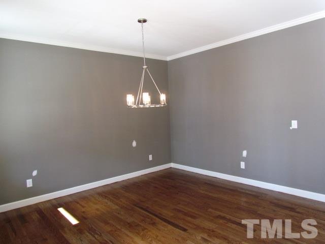 1644 Forest Road Wake Forest, NC 27587 - Photo 4 of 23 Site finished hardwood floors, brushed nickel chandelier, crown moulding, custom wall color