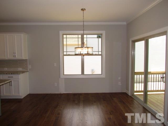 1644 Forest Road Wake Forest, NC 27587 - Photo 9 of 23 Located just off the kitchen and opens to the family room. Breakfast area has gorgeous brushed nickel light fixture, crown moulding, site finished hardwoods.