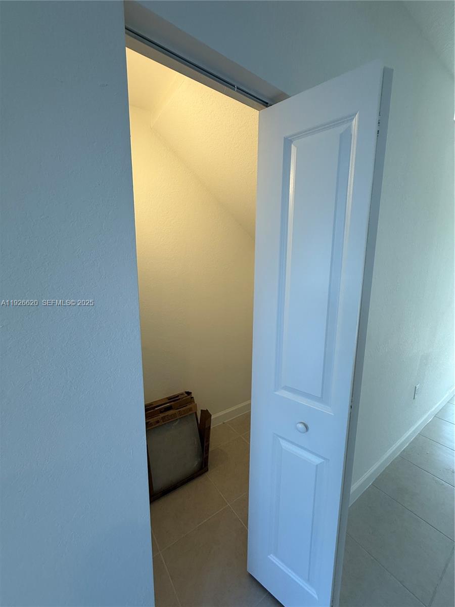 26846 Southwest 121st Court Homestead, FL 33032 - Photo 17 of 37 a view of a closet in a room