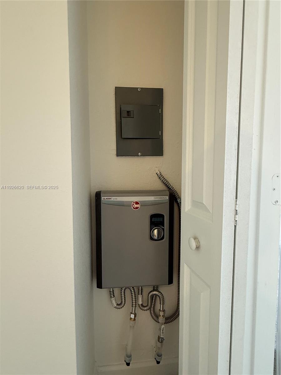 26846 Southwest 121st Court Homestead, FL 33032 - Photo 20 of 37 a bathroom with a sink and mirror