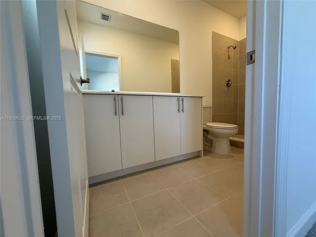 a bathroom with a toilet a sink and bathtub