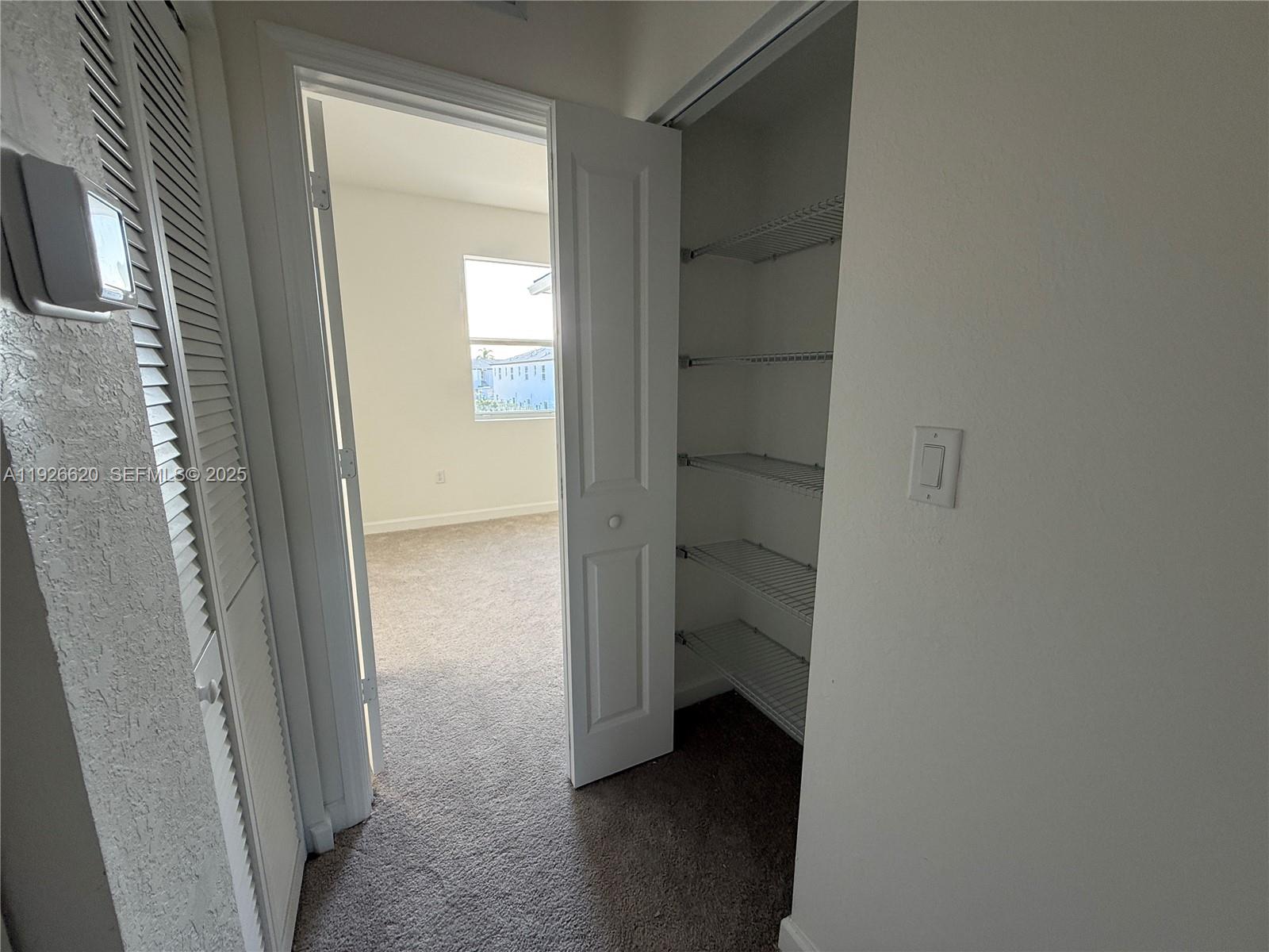 26846 Southwest 121st Court Homestead, FL 33032 - Photo 27 of 37 a view of a bathroom from a hallway