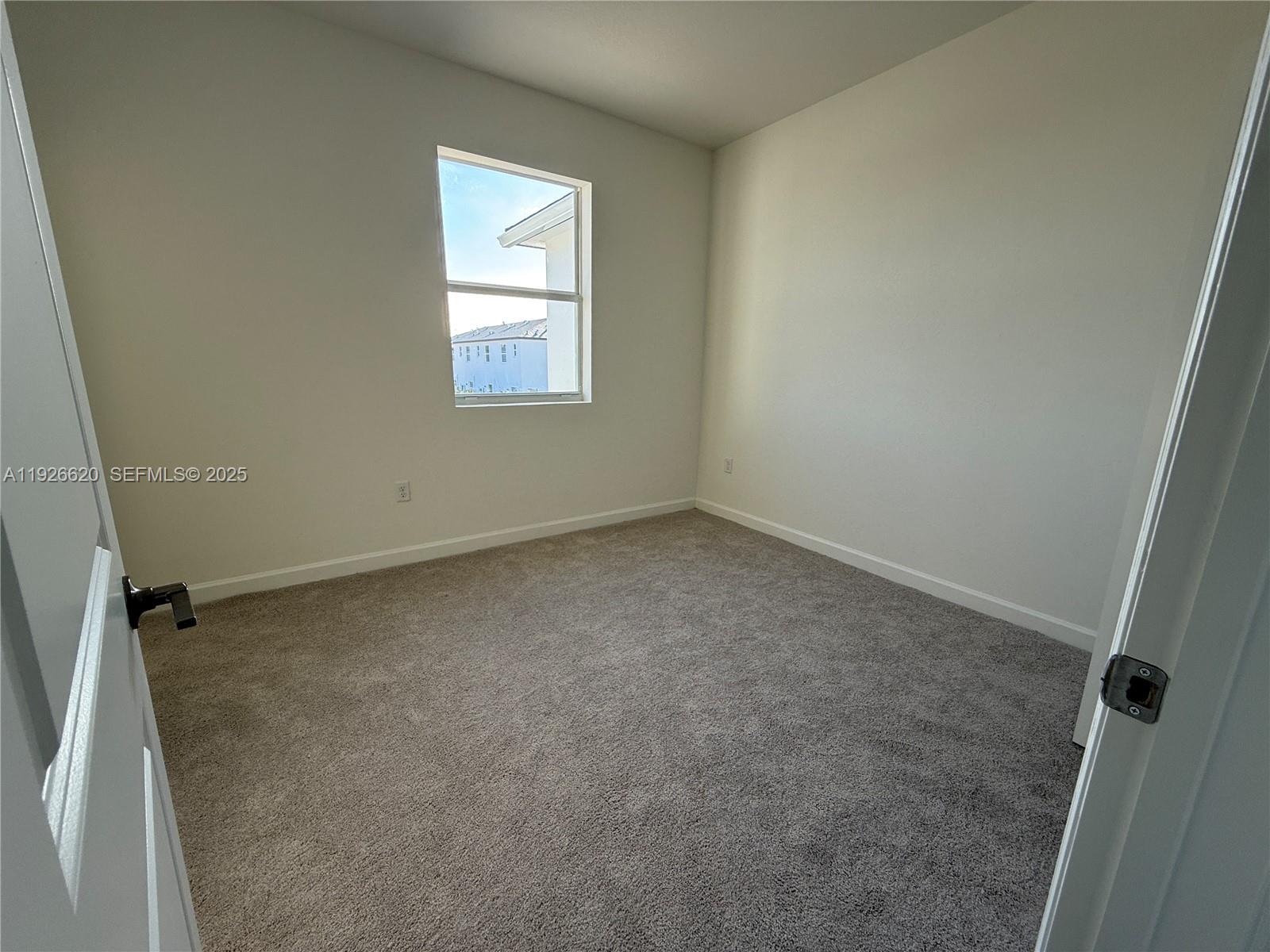 26846 Southwest 121st Court Homestead, FL 33032 - Photo 28 of 37 an empty room with windows