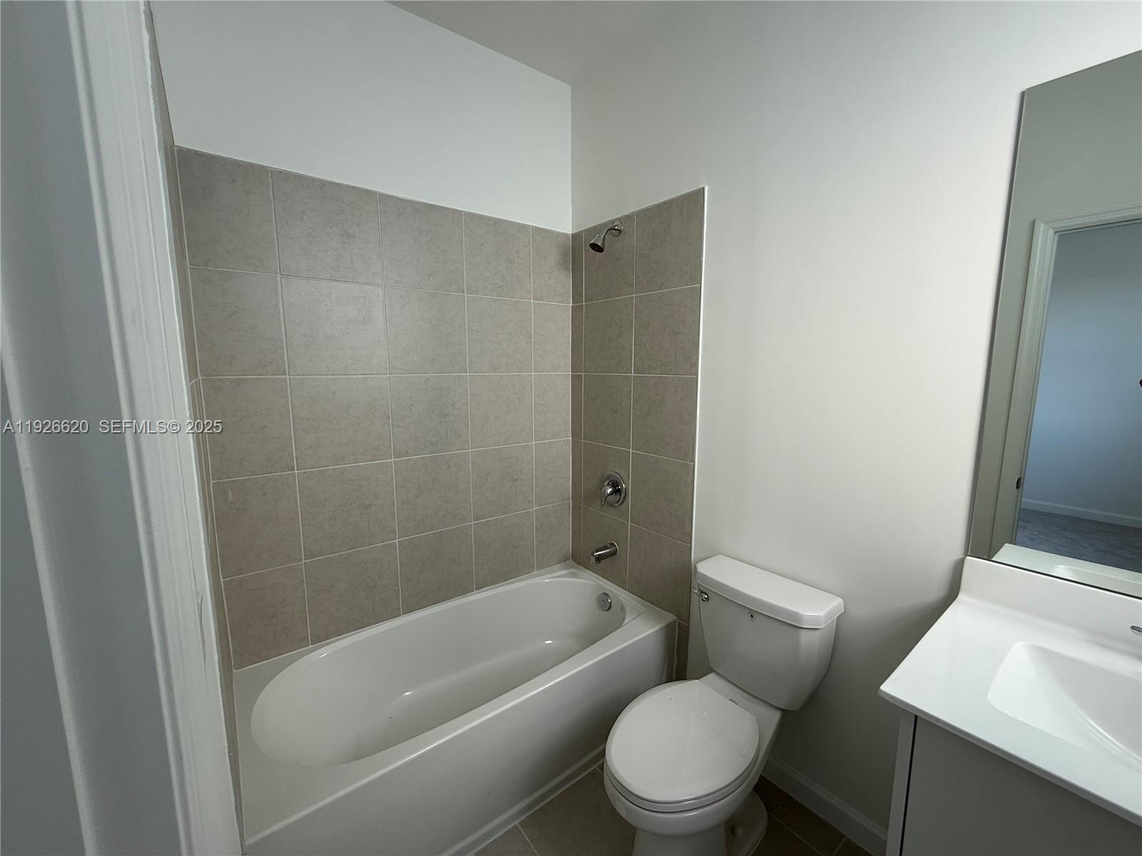 26846 Southwest 121st Court Homestead, FL 33032 - Photo 31 of 37 a white toilet sitting next to a bath tub