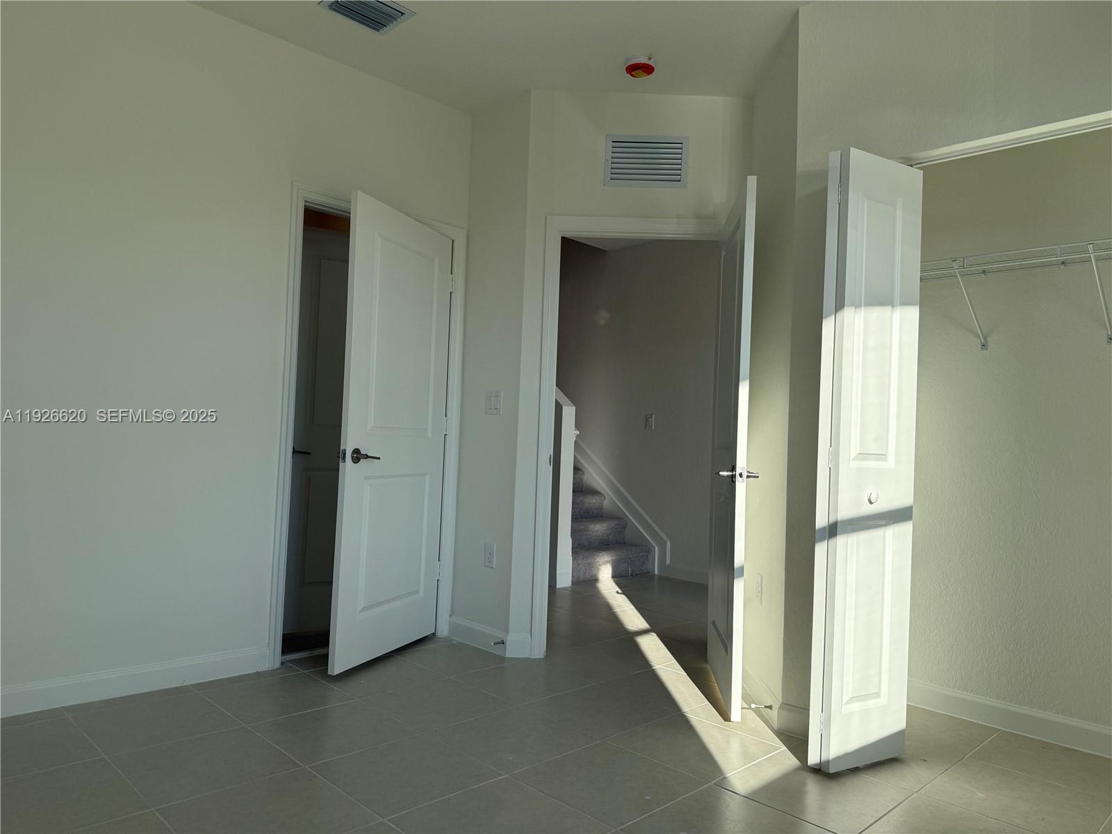 26846 Southwest 121st Court Homestead, FL 33032 - Photo 4 of 37 a view of a hallway with staircase