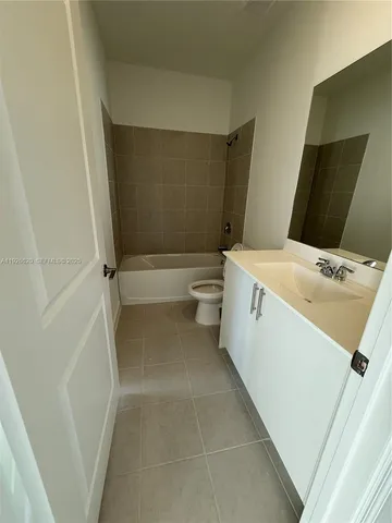 a view of a livingroom with an empty space and a window