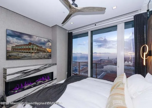 a bedroom with a bed and a television