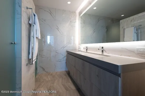 a bathroom with a double vanity sink mirror and double