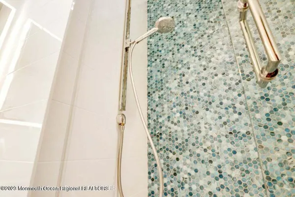 a bathroom with a shower and a shower curtain
