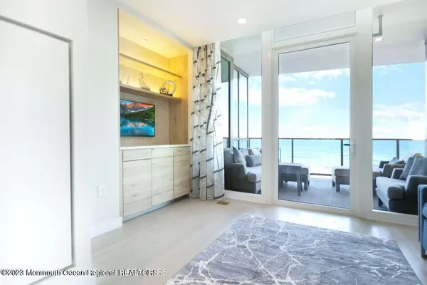 a view of living room filled with furniture and window