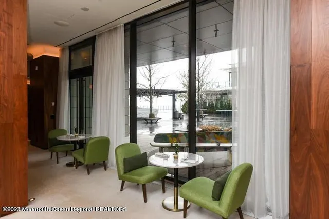 a living room with lots of furniture and window