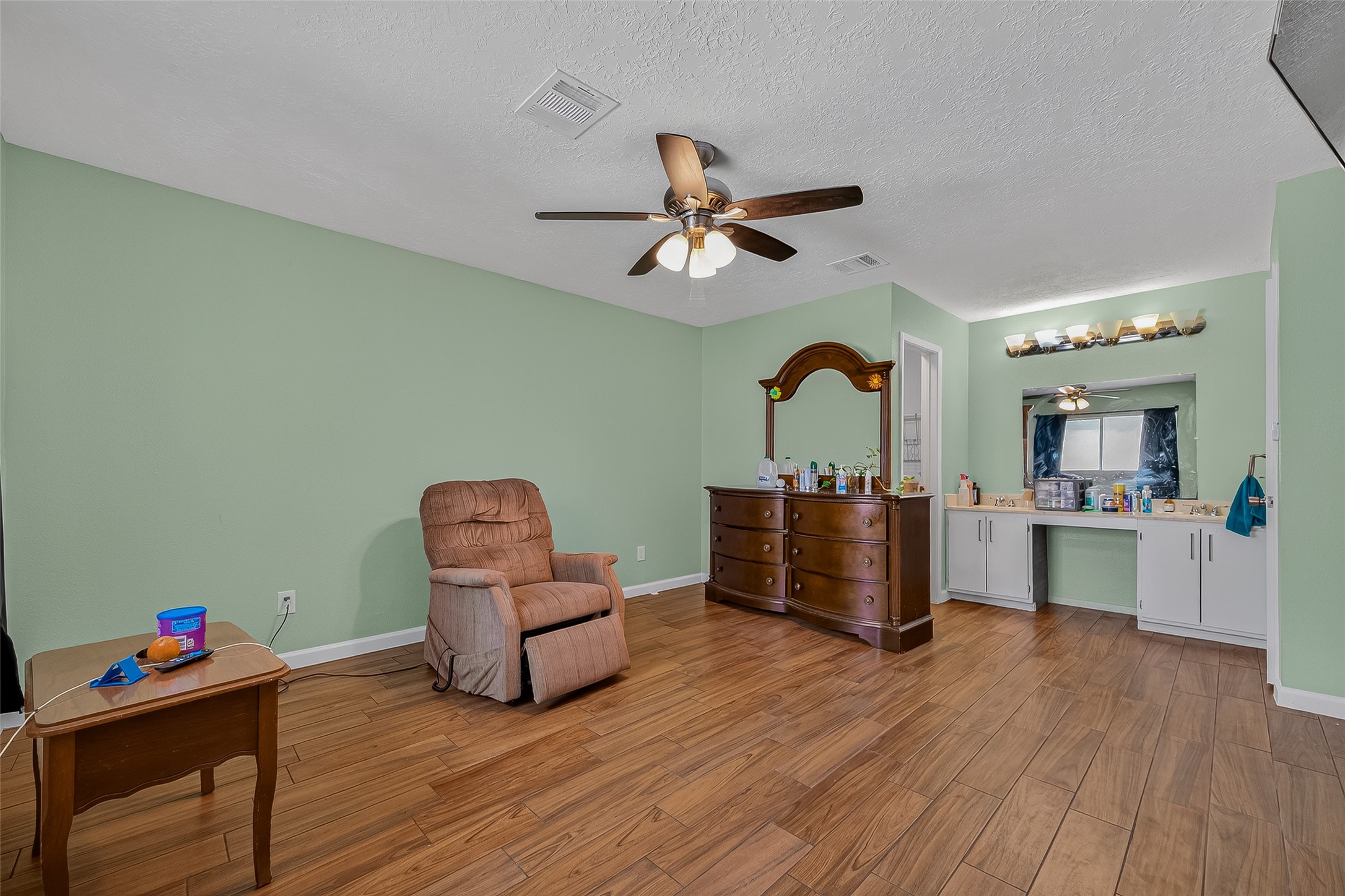 2719 Flintrock Circle Houston, TX 77067 - Photo 12 of 22 a living room with furniture and wooden floor