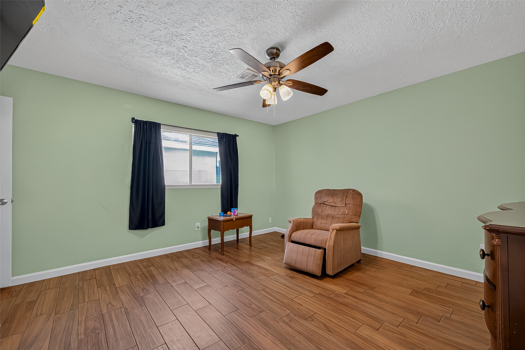 2719 Flintrock Circle Houston, TX 77067 - Photo 13 of 22 a room with wooden floor and a window