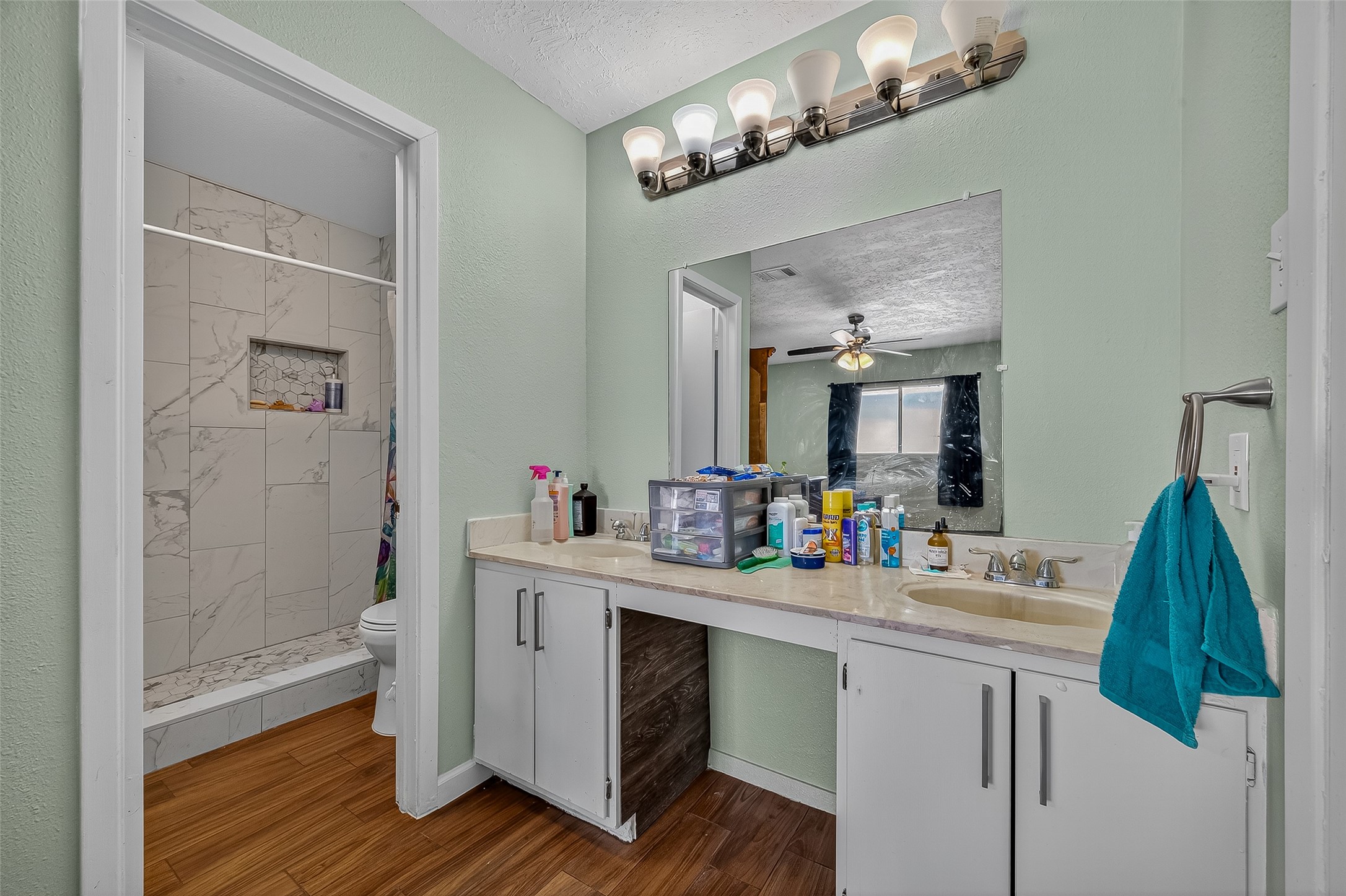 2719 Flintrock Circle Houston, TX 77067 - Photo 14 of 22 a bathroom with a sink double vanity and a mirror