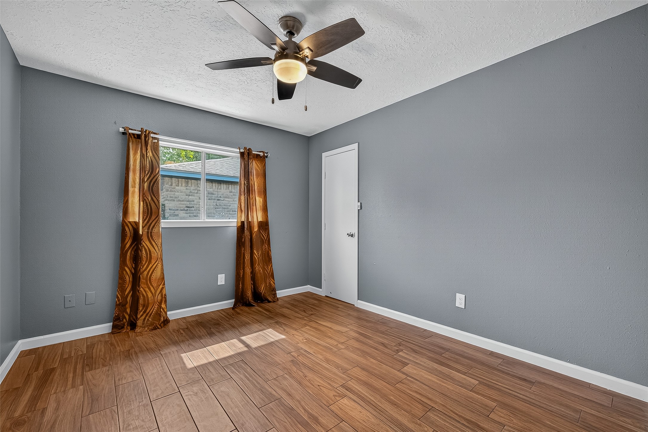 2719 Flintrock Circle Houston, TX 77067 - Photo 16 of 22 an empty room with closet and windows