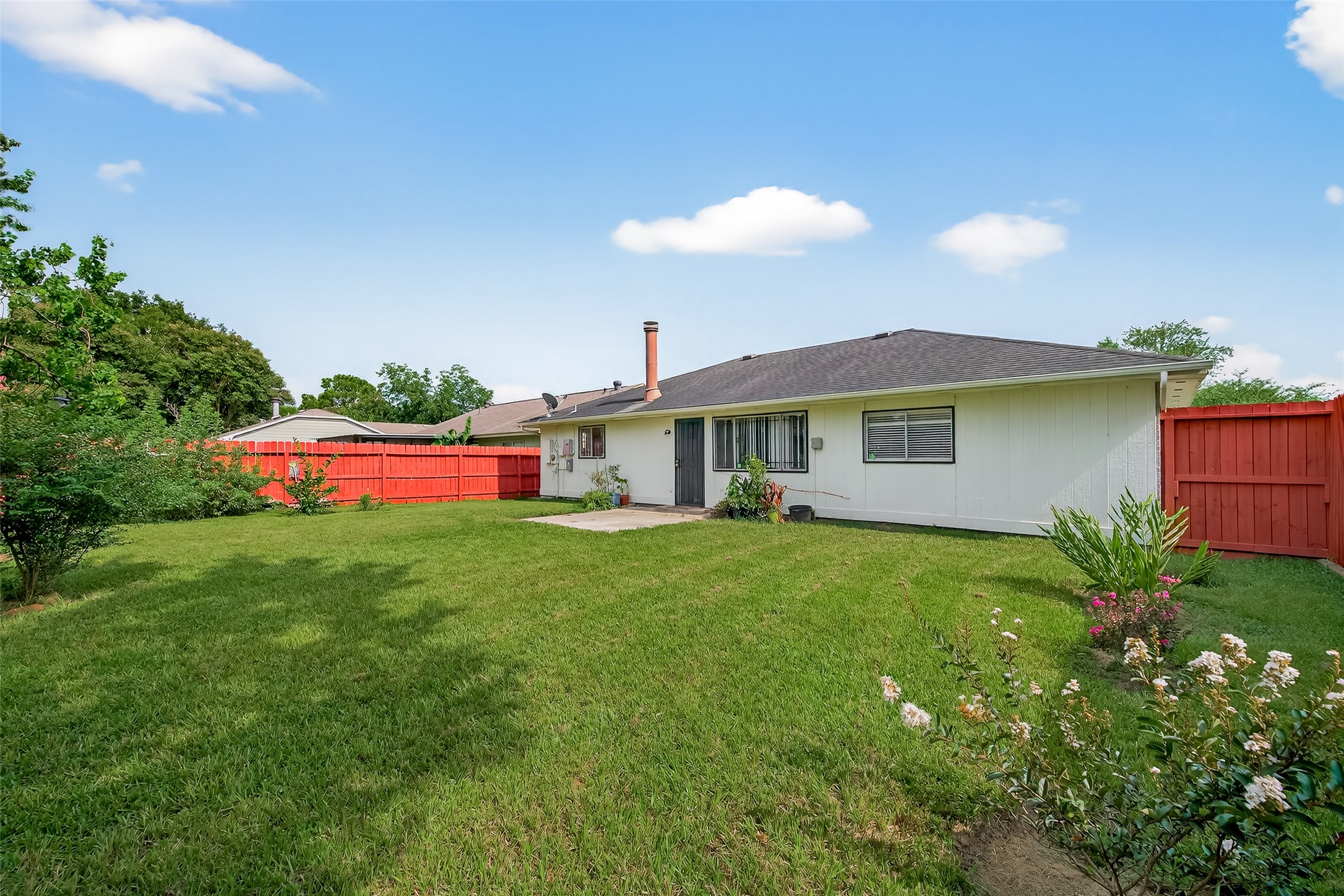 2719 Flintrock Circle Houston, TX 77067 - Photo 22 of 22 a view of a house with a yard and sitting area