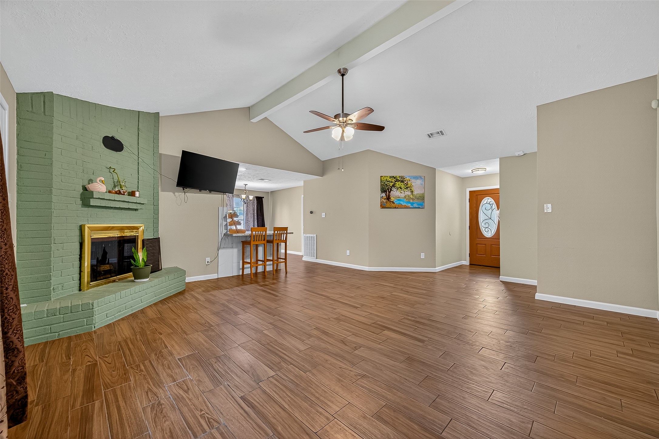 2719 Flintrock Circle Houston, TX 77067 - Photo 4 of 22 a view of empty room with wooden floor and fireplace