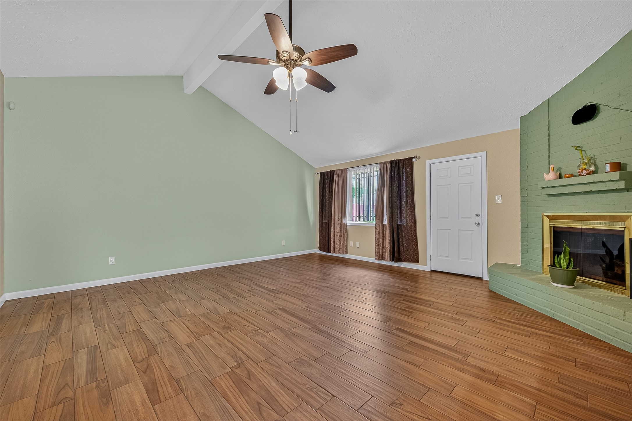 2719 Flintrock Circle Houston, TX 77067 - Photo 5 of 22 wooden floor in an empty room with a fireplace