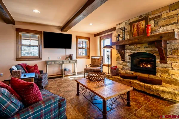 a kitchen with stainless steel appliances granite countertop a sink a stove and a wooden cabinets