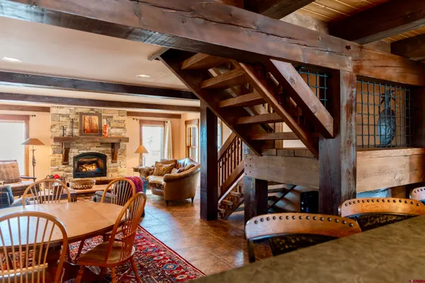 a view of staircase with wooden floor and chair