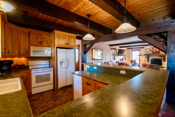 a bathroom with a sink a vanity and a large mirror