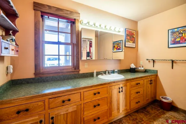 a view of a livingroom with furniture and floor to ceiling window