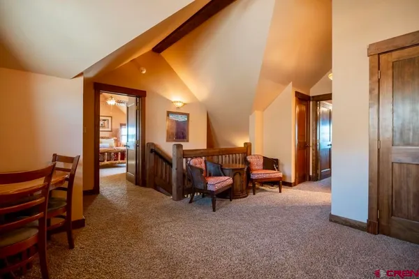 a bathroom with a granite countertop toilet sink and mirror
