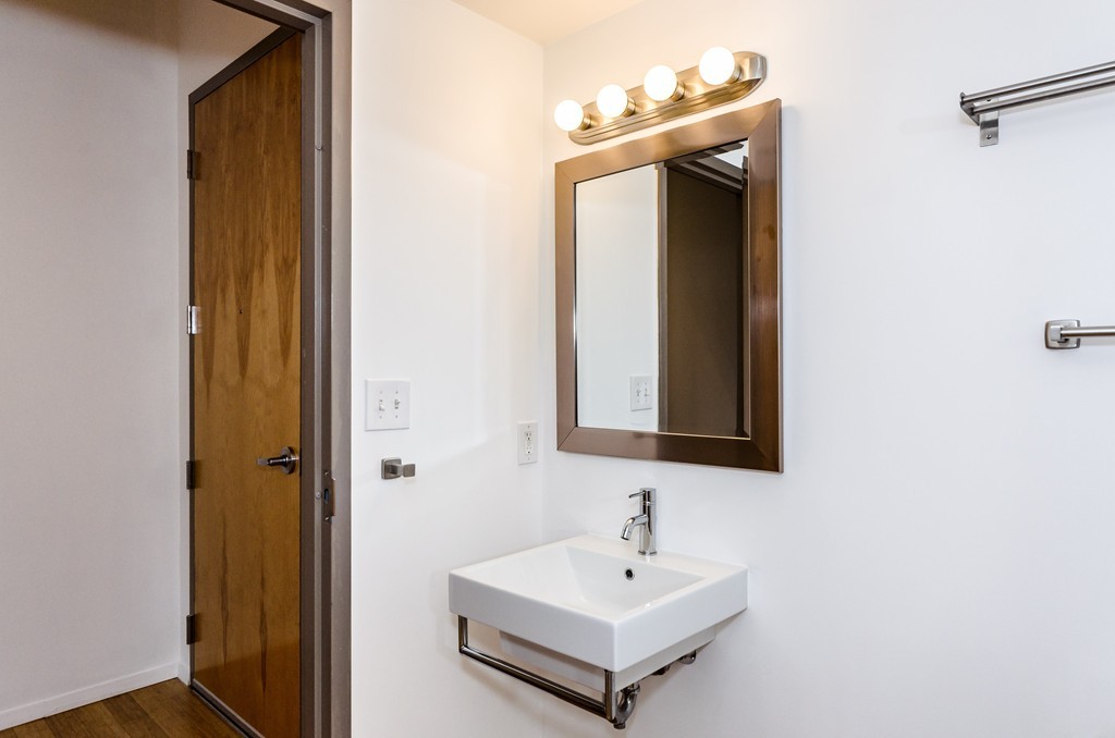 156 Porter Street, Unit 236 Boston, MA 02128 - Photo 9 of 16 a bathroom with a sink and a mirror