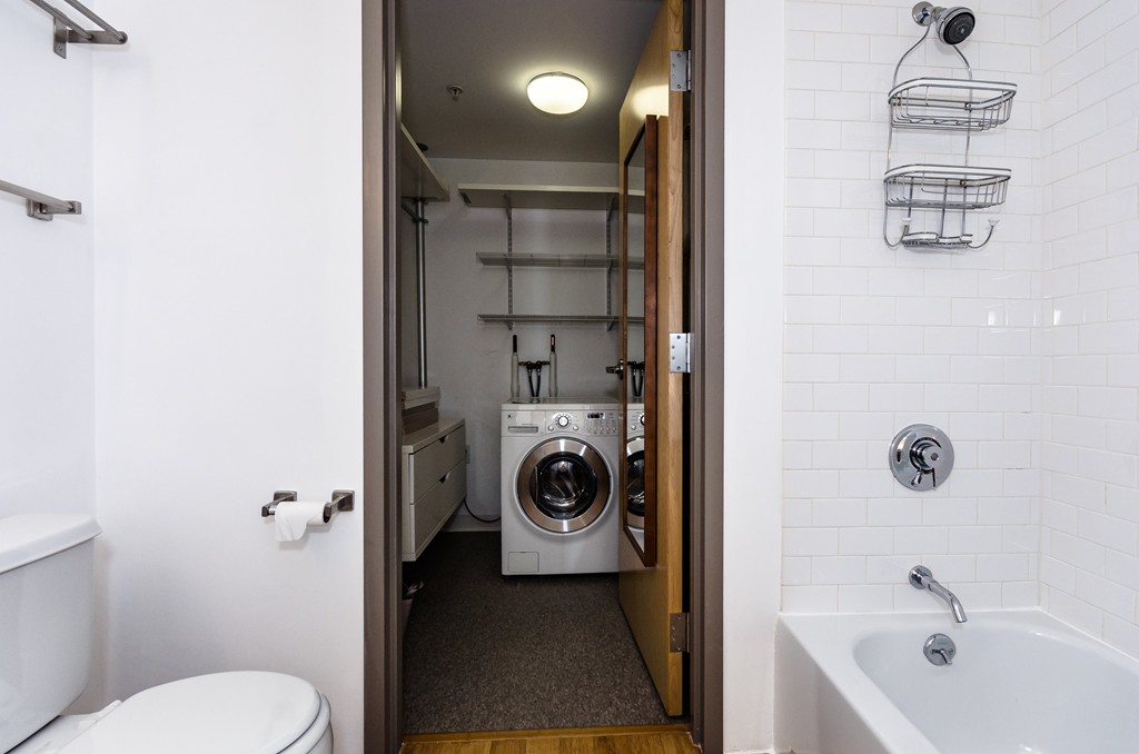 156 Porter Street, Unit 236 Boston, MA 02128 - Photo 10 of 16 a bathroom with a toilet a sink and mirror