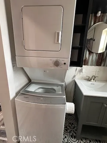 a view of a small yard with wooden fence