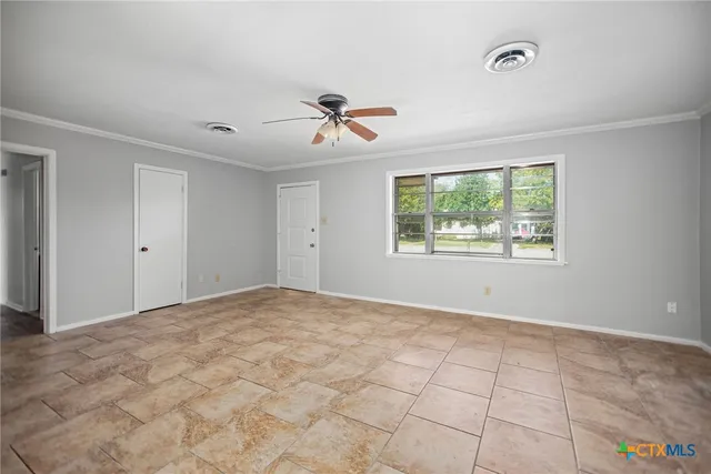 a view of an empty room with windows