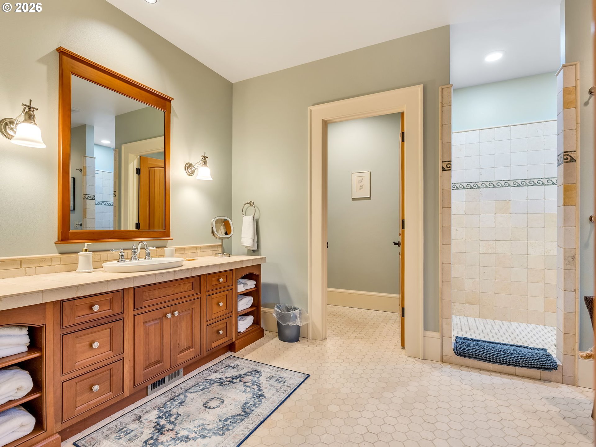 89079 Pinehurst Road Warrenton, OR 97146 - Photo 35 of 46 a spacious bathroom with a granite countertop sink mirror and shower