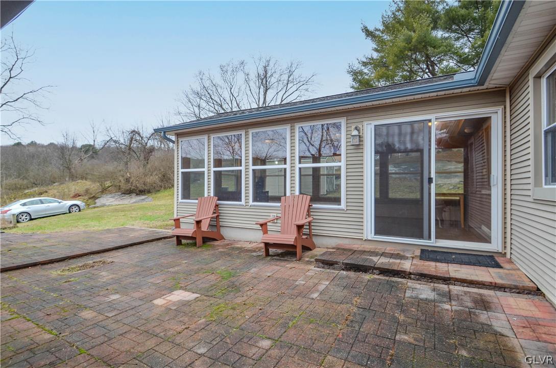 49 Sutton Road Shavertown, PA 18708 - Photo 36 of 45 a backyard of a house with barbeque oven table and chairs